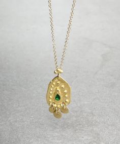 Boho gold necklace 9k 14 k Solid gold necklace with green emerald May birthstone, Yellow gold necklace, Delicate Pendant, Gift for her This solid gold necklace has a rustic textured and is set with a natural green emerald. The pendant has a delicate granulation all around it. This pendant is delicate but has a lot of character, and will upgrade any outfit you'll wear, for everyday use, as for special occasions The pendant can be ordered without the chain too. An excellent choice for anniversary Gold Necklace Delicate, Delicate Pendant, Solid Gold Necklace, Yellow Gold Necklace, Dainty Gold Necklace, May Birthstone, Oval Pendant, Green Emerald, Minimalist Necklace