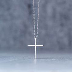 Minimal solid gold handmade cross necklace, unisex cross, great for men and women alike. Available in 14k yellow and 14k white gold, please make your choice from the drop down menu. This pendant has a shiny/polished finish. Size: 1,9 cm / 0.8 inches long and 1.5cm / 0,6 inches wide Material: 14k solid yellow gold, 14k solid white gold You can choose the charm with a 14k solid gold chain or without a chain. Perfect Birthday gift, Baptism gift or for any other special occasion. Comes in gift box. Minimalist Yellow Gold Cross Necklace Gift, Classic Cross Jewelry For Everyday, Minimalist White Crucifix Jewelry, Minimalist Sterling Silver Crucifix Necklace, Minimalist Cross Pendant Necklace For Gift, Everyday Classic Cross Pendant Necklace, Classic Everyday Cross Pendant Necklace, Minimalist White Gold Cross Necklace, Minimalist Cross Necklace Gift