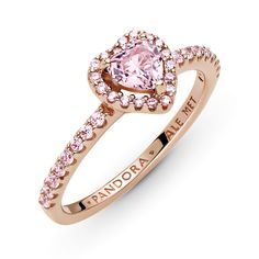 Add a sophisticated touch to your look with the Sparkling Elevated Heart Ring. The ring draws inspiration from the classic Pandora Timeless collection. Hand-finished in 14K rose gold unique metal blend, this piece features a pink heart-shaped central, elevated crystal. Clear cubic zirconia create the halo and decorate half of the ring band, with the Pandora logo inside the shank. Stack this ring with hand-finished styles in sterling silver for a statement mixed metal look. Pink Gold Heart Promise Ring In Fine Jewelry Style, Pink Rings Heart, Pandora Pink Heart Ring, Heart Ring Pandora, Pandora Rings Gold, Rose ￼gold Pandora Ring, Pandora Rings Heart, Pink Heart Rings, Pandora Logo