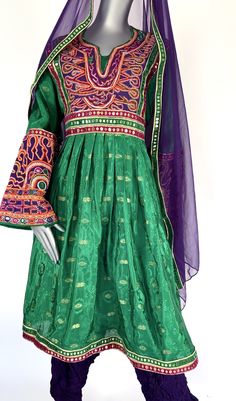 Afghani Dress Traditional Afghan Dress With beautiful high quality Banarasi fabric- Kuchi Dress Green and Purple Multicolor (US based Seller) This dress is perfect and light. Note: The Dress will ship from California, USA within 3 business days Please follow us on instagram @baranaboutiquellc Size: S/M US with adjustable belt (Bust 39 inch Dress Length 42 inch) Afghan Dress Handmade with love and care with traditional Afghani style Dress Afghan Clothes Tribal Kuchi Dress These Afghan clothes are Semi-stitched Banarasi Silk Dress With Pallu, Fitted Dresses In Art Silk For Traditional Ceremonies, Fitted Art Silk Dresses For Traditional Ceremonies, Traditional Floor-length Choli For Celebrations, Traditional Patterned Gown For Eid Wedding, Traditional Gown With Patterns For Eid Wedding, Fitted Chanderi Dress For Traditional Ceremonies, Traditional Patterned Gown For Wedding And Eid, Green Dresses With Traditional Patterns For Ceremonies