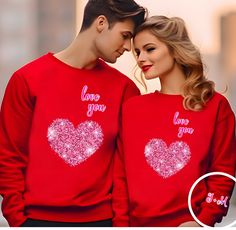 "Customized sleeve Couples Initials Valentines Day gift says Love you Couples matching Personalized comfortable soft Sweatshirts unique gift Introducing our cozy and stylish Gildan 18000 Crewneck Sweatshirt and Gildan 18500 Hoodie Sweatshirt, both adorned with a heartwarming graphic that spreads love effortlessly. The front features a charming \"love you\" message encased in a heart, making it the perfect expression of affection. On the sleeve, a personalized touch awaits with a unique design showcasing a couple's initials like J+M. Crafted from the finest materials, these sweatshirts guarantee comfort and durability. The Gildan 18000 Crewneck Sweatshirt offers a classic fit with ribbed cuffs and waistband, ensuring a snug yet flexible feel. Meanwhile, the Gildan 18500 Hoodie Sweatshirt br Couples Style Tops For Valentine's Day Gift, Custom Couple Sweatshirts, Valentine's Day Gift Sweatshirt, Personalized T-shirt For Valentine's Day Gift, Crew Neck T-shirt For Valentine's Day Anniversary, Hoodie Cozy, Couples Sweatshirts, Gildan Hoodie, Crewneck Design