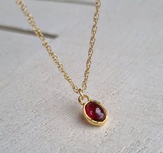 "Garnet necklace, 14k gold pendant necklace, January birthstone necklace mom, Red Garnet necklace, January Birthday, Gold Garnet Jewelry This minimalist Garnet necklace was set with a deep red January birthstone pendant, to beautifully accompany you through your busy days. The classic design is always pretty for day and evening, work or fun. The Red oval necklace is handmade and delicate and is just a great January birthstone necklace and the perfect chic and elegant gift. You can click here to Dainty Red Birthstone Necklace, Dainty Red Jewelry For Birthday Gift, Red Dainty Birthstone Jewelry, Dainty Red Birthstone Jewelry, Red Gemstone Birthstone Necklace Gift, Dainty Red Necklace For Birthday Gift, Dainty Red Necklace For Anniversary, Red Necklaces For Birthday And Mother's Day, Red Birthstone Necklace For Valentine's Day