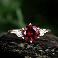 "This is a 1.25 carat garnet engagement ring in solid gold,about 7mm round cut. The accent stones are moissanites,forever classic quality. It can be made in any ring size. However please contact me to custom make it to a special big or small size. It can be made in white gold,rose gold or yellow gold with 14k or 18k. However for some people who are nickel allergic,I can also make it to 925 sterling silver to make you can wear it. The ring is handmade,very high quality! 30 days money back guarant Elegant Round Ruby Promise Ring, Lab-created Ruby Diamond Ring With Prong Setting, Classic Promise Jewelry With Lab-created Ruby, Timeless Garnet Jewelry For Anniversary, Classic Lab-created Ruby Jewelry For Promise, Round Garnet Promise Jewelry, Garnet Solitaire Jewelry For Promise Ring, Round Garnet Jewelry For Promise, Elegant Jewelry With Lab-created Ruby For Promise