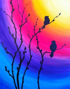 an image of two birds sitting on a tree branch in front of a colorful sky