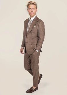 Be the best dressed at your next event with the Tawny Brown Hopsack Suit. This cool and stylish suit exudes elegance and luxury. Custom made from a luxurious bamboo/wool/linen/silk blend from Cavani, you're guaranteed to look as good as you feel. Dress to impress with this must-have suit. Elegant Linen Tweed Jacket With Welt Pockets, Luxury Linen Tweed Jacket With Notch Lapel, Timeless Beige Linen Suit, Elegant Linen Suits With Notch Lapel, Brown Semi-formal Suits For Spring, Luxury Linen Tweed Jacket For Business, Luxury Double Breasted Business Suit For Spring, Elegant Linen Tweed Jacket For Work, Luxury Linen Suits