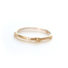 Introducing the original Dainty Ring - a must-have for every ring stack! Made from 14k yellow gold, this ring is both delicate and chic. Wear it alone for a minimalist look or stack it up to create a personalized set. Handcrafted with care, each ring is unique, showcasing its own rustic character. Measuring 1mm in width, this ring is the perfect addition to your jewelry collection. • Please note that Amy will need two weeks to create your ring with utmost attention to detail. Everyday Fine Jewelry: 14k Gold Stackable Rings, Minimalist 14k Rose Gold Solitaire Jewelry, Everyday 14k Gold Fine Jewelry Stackable Rings, Everyday 14k Gold Stackable Rings Fine Jewelry, Everyday 14k Gold Stackable Rings, Delicate Stackable 14k Rose Gold Rings, Everyday Stackable Diamond Ring With Round Band, Minimalist 14k Rose Gold Promise Ring, Simple Stackable Open Band Rings