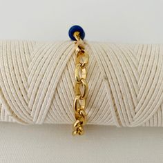 This is two looks in one bracelet. Half of the bracelet is beaded with gold and lapis beads and the other half is a chunky bold gold chain. It measures 18 inches in length and can be adjusted to a smaller size. Please note that the white bracelet shown in some of the photos is not included but can be purchased under Nico-White Adjustable Brass Chain Bracelet With Gold Chain, Blue Adjustable Chain Bracelet For Everyday, Everyday Blue Bracelet With Adjustable Chain, Gold Beaded Lapis Lazuli Bracelets, Gold Metal Chain Bracelet With Beaded Chain, Gold Metal Chain Bracelet With Beaded Detail, Gold Metal Chain Bracelet With Beads, Adjustable Blue Chain Bracelet, White Bracelet