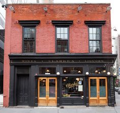 an old brick building with two wine cellars on the front