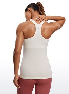 Seamless collection of smooth, breathable fabric is designed to help reduce chafing, encourage ventilation and wick away sweat to help you stay dry. Y-back and scoop neck gives you a stylish look. Built in shelf bra with removable pads provides extra support. Feature & Fitting: 
 Seamless collection 
 Design for yoga 
 Y-back 
 Built in bra & removable pads 
 Fabric: 
 Chafe-free, seamless construction 
 Sweat-wicking, soft ribbed textured fabric 
 Lightweight and stretchy 
 Body: 100% P Stretch Ribbed Racerback Sports Bra, White Seamless Scoop Back Top, White Seamless Top With Scoop Back, White Seamless Tops With Scoop Back, Solid Supportive Seamless Tank Top, Supportive Seamless Solid Tank Top, Ribbed Stretch Racerback Activewear, Ribbed Medium Support Tank Top For Sports, Medium Support Ribbed Tank Top For Sports