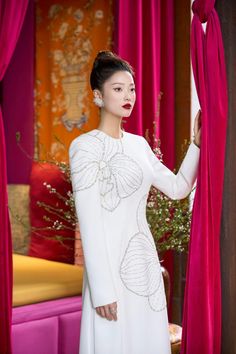 Lumins Sheath Round Neck Velvet Satin Floor Length Ao Dai | MEAN BLVD Fitted Long Sleeve Evening Dress For Ceremony, Elegant Fitted Silk Ao Dai, Elegant White Ao Dai For Formal Occasions, White Long Sleeve Glamorous Evening Dress, Elegant Long Sleeve Ao Dai For Wedding, Glamorous White Long Sleeve Evening Dress, Luxury Long Sleeve White Dress, Elegant Ao Dai For Wedding, White Silk Embellished Evening Dress