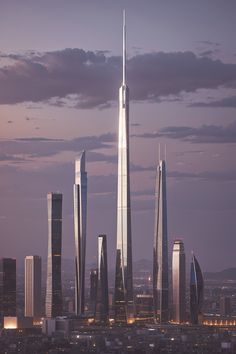 an aerial view of skyscrapers in the city at dusk, with lights shining on them