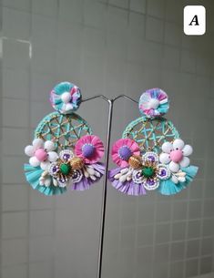 Handmade Statement Floral Pink-Purple - Blue Hoop Earrings. These stunningly beautiful, purely handmade and handcrafted,intricate earrings are made using raffia, handmade flowers, fabric pompoms, glass beads, and a lot more. The earrings have unique intricate workmanship and undoubtedly beautiful. The earrings are ideal for day parties or just wear them as you want.. The earrings measure approx. 3.20" long and 2.60" wide. Available in two color options: A and B At Carnation jewellery, each piece is artisan handcrafted with love and care and shipped from India.  * SHIPPING - Please refer to the "announcement" page of the store. * Please be noted all kind of taxes, custom duties, VAT etc will be borne by the buyer as I am not responsible for the same. * For queries, please reach out to me an