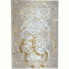 an area rug with gold and white designs on it