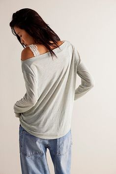 Add a cool and classic touch to your tops collection with this so cool long sleeve tee featured in a drapey, relaxed fit with subtle cowl-inspired neckline for added shape. **Fit:** Classic, relaxed fit **Features:** Wide neckline, exposed seaming, heathered fabrication **Why We | Kimmi Long Sleeve by Free People in Blue, Size: XL Relaxed Long Sleeve Tops, Chic Long Sleeve Loungewear Top, Summer Layering Top With Relaxed Fit, Slouchy Top For Summer Layering, Summer Slouchy Tops For Layering, Casual Slouchy Tops For Fall, Casual Slouchy V-neck Tops, Casual Long Sleeve Scoop Neck Top For Layering, Slouchy Summer Loungewear Tops