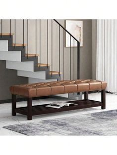 a bench sitting in front of a stair case