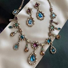 "This French 1700s inspired necklace features vintage cut crystal stones in exotic tourmaline shades of blues, amethyst, champagne, green and seed pearls. The stones are in perfect, never used condition, acquired when I first designed and produced the necklace for the Victoria & Albert Museum. Each of the elements is exquisitely sculptured and joined to create a fluid collar in the Regency style. It is titled Juliette for the woman who inspired it -- Juliette Recamier -- whose famed Paris salon Vintage French Jewelry, Bridgerton Jewelry, Regency Jewelry, French Regency, Vintage Statement Jewelry, Jeweled Collar, 18th Century Costume, Antique Costume Jewelry, Locket Bracelet