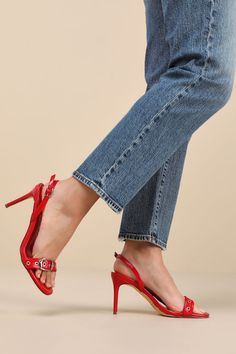 The Lulus Cleore Red Slingback Buckle High Heel Sandals are majorly iconic and will enhance any of your favorite OOTN! Crinkled faux leather shapes these too-stunning heels that feature a single sole silhouette, a rounded footbed, and a wide toe strap accented with silver grommets and a buckle-like detail. An adjustable, slender slingback strap secures with a dainty buckle, all atop a seriously sexy stiletto heel. 3. 5" stiletto heel. Cushioned insole. Rubber sole has nonskid markings. Man made Designer Slingback Pumps For Party With Buckle Closure, Designer Slingback Pumps With Buckle Closure For Party, Designer Slingback Heels With Buckle Closure, Red Slingback Sandals For Spring Party, Spring Red Slingback Sandals For Party, Chic Fitted Slingback Sandals With Single Toe Strap, Spring Party Red Slingback Sandals, Red Patent Leather Heels With Buckle Closure, Designer Red Leather Slingback Pumps