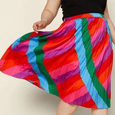 Multicolored Pleaded Skirt With Elastic Waist Band. 100% Polyester Multicolor Lined Midi Skirt, Multicolor Midi Skirt, Multicolor Pleated Midi Skirt For Summer, Casual Multicolor Lined Pleated Skirt, Casual Multicolor Pleated Skirt With Lining, Colorful Vibrant Skirt For Spring, Vibrant Colorful Skirt For Spring, Casual Pleated Multicolor Skirt, Casual Multicolor Patterned Skirt