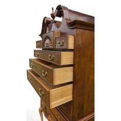 a wooden dresser with drawers and knobs on it's sides, against a white background