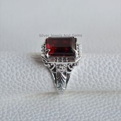 Gemstone-Garnet Shape-Rectangle Stone Size- 10x12 MM Metal-925 Sterling Silver This One of a kind ring is adorned with beautiful Garnet Gemstone set in sterling silver. About gemstones-Garnet is intense red color stone resembling the glistening, deep red seeds of the fruit. This red stone is associated with true friendship, devotion,loyalty, self esteem, success and passion. Garnet protects from negativity and warn off evil spirits and leads way to spiritual world. Wearing Garnet stone promotes Classic Square Sterling Silver Rings, Hallmarked Rectangular Ruby Ring For Formal Occasions, Classic Anniversary Ring With Rectangular Shape, Square Gemstone Jewelry For Anniversary, Fine Jewelry Ruby Ring, Rectangular For Formal Occasions, Classic Rings With Rectangular Stone For Gift, Rectangular Rings With Accent Stones For Anniversary, Classic Ring With Rectangular Stone For Gift, Formal Ruby Ring With Rectangular Stone