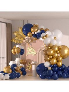 a bunch of balloons that are sitting on a table in front of a fireplace with the words happy birthday written on it