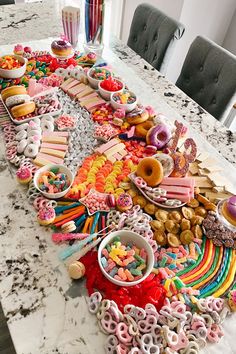 A candy table that is like a charcuterie board but made out of candy and small mini dessert items, the theme was colorful for a 13th birthday party Birthday Candy Board, Birthday Sleepover Ideas, Candy Board, Candy Land Birthday Party, Birthday Snacks, Candyland Birthday, Sleepover Food