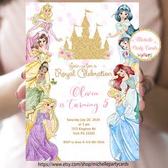 a person holding up a card with princesses on it