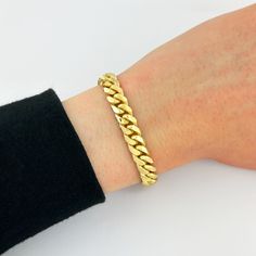 This 8mm Miami Cuban Link Bracelet is made in Solid 18k Yellow Gold and is secured with a Box-Lock Clasp. Perfect for any occasion, this bracelet guarantees you that rich and luxurious look! Mour & Co. is a reputable jewelry company that has been in the jewelry industry for MANY years. I deeply value all of my clients, therefore, I only provide you with the highest-quality jewelry and phenomenal customer service. All of my jewelry is crafted from real, genuine solid gold so it can be enjoyed for a lifetime without fading, tarnishing, or turning green. Orders are fulfilled within 1-2 business days ensuring a fast delivery--YOUR happiness is MY happiness! * DETAILS: Width: 8mm Length: Use the drop-down menu to select your preference! Metal: 18k Yellow Gold - SOLID GOLD (not hollow or semi-ho Luxury Cuban Link Chain Bracelet As Gift, Luxury Curb Chain Bracelet, Cuban Link Bracelet With Polished Finish As Gift, Luxury Cuban Link Bracelet As Gift With Solid Construction, Classic Cuban Link Bracelet As Gift, Luxury Cuban Link Curb Chain Bracelet For Anniversary, Luxury Yellow Gold Rectangular Tennis Bracelet, Luxury Tarnish Resistant Rectangular Bracelet, Luxury Chain Bracelet With Solid Link Construction