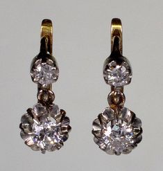 A splendid pair of French 18K gold platinum diamond earrings from Edwardian period C.1900. The earrings measure 12 mm high 6 mm wide. The diamonds are old European cut. The bottom ones measure 3.5 mm diameter or 0.15 Ct. The top diamonds are 2.5 mm or 0.15 Ct. The diamonds are set in platinum. The back of the earrings and the lever back clasps are 18K gold. The earrings are hallmarked with eagle - the French stamp for 18K gold. Platinum acid tested. Total weight is 2.9 grams. Excellent antique c 14k Gold Silver Earrings With Rose Cut Diamonds, Classic Gold Hallmarked Diamond Earrings, Classic Gold Diamond Earrings Hallmarked, Platinum Earrings With Single Cut Diamonds For Wedding, Classic Gold Earrings With Rose Cut Diamonds, Classic Yellow Gold Diamond Earrings For Formal Occasions, Classic Gold Earrings With Single Cut Diamonds, Formal White Gold Diamond Earrings With Single Cut Diamonds, Formal White Gold Diamond Earrings With Single Cut