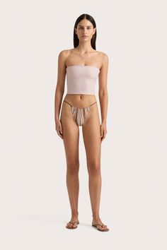 A fitted strapless swim top, cropped just above the waist. Printed in subtle floral motif, pair with the Eléa String Bikini Bottom or style as ready-to-wear with a relaxed pair of trousers. Cropped Bottoms For Beach Season, Spring Cropped Beachwear Bottoms, Chic Bandeau Summer Bottoms, Summer Cropped Fitted Bottoms, Fitted Cropped Summer Bottoms, Summer Cropped Beachwear Bottoms, Chic Bandeau Tube Top For Poolside, Fitted Cropped Bottoms For Vacation, Feminine Fitted Tube Top For Beach