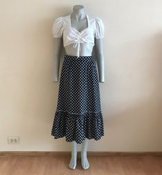 "Dirndl Skirt Black White Polka Dot Skirt Ruffled Dirndl Skirt High Waist Cotton Size label: 40 Measurements(lying flat): Length: 31\"/ 79 cm Waist: 13 3/4\"/ 35 cm (lying flat)  Please check measurements to insure a proper fit. Remember to allow yourself some extra room for movement. You can compare these with something from your closet that fits you well. Please convo me if you need additional measurements. Condition: great Vintage Condition Material:100%cotton. Lining:100%acetat N.B. Color ma Polka Dot Ruffled Skirt For Summer, Polka Dot Flared Skirt For Summer, Flared Polka Dot Skirt For Summer, Casual Long Polka Dot Skirt, Fitted Polka Dot Skirt For Summer, Casual Ruffled Polka Dot Skirt, Casual Polka Dot Tiered Skirt, Polka Dot Tiered Skirt With Ruffles, Casual Polka Dot Ruffled Skirt