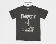 Raw energy post-hardcore Comfort Colors® 1717 vintage style Fugazi t-shirt. Featuring a design inspired by the iconic rock band, this streetwear summer shirt is perfect for fans of Fugazi, Alternative Rock, and Rock Music. Whether you're hitting a music festival or enjoying a casual day out, this tee lets you showcase your passion for the genre. As a retro band shirt, it captures the spirit of Fugazi's unforgettable sound and influence. A vintage band tee that's a versatile addition to any wardr Summer Streetwear Shirt With Band Logo, Grunge Streetwear Shirt With Front Print, Grunge Style Shirt With Front Print For Streetwear, Grunge Front Print Shirt For Streetwear, Alternative Pre-shrunk Streetwear Shirt, Pre-shrunk Alternative Streetwear Shirt, Fugazi Band, Hardcore Music, Retro Band