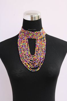 Beaded choker necklace, Beaded women jewelry, African boho necklace, Christmas gift for her, Moms gift, Fringe necklace, Tribal necklace An elegant necklace that can match any outfit. Handmade by the Maasai women in Kenya using fine beads. Neck size: 14 inches Available in different colors Color: Rainbow 3-5 days delivery via DHL Express. Pay shipping fee for the first item only and additional items ship for free. To view more items in our shop, kindly click here: nkoroicrafts.etsy.com Bohemian Bib Necklace With Polished Beads As Gift, Adjustable Beaded Necklaces With Dangling Beads For Festivals, Handmade Beaded Choker For Festivals, Adjustable Beaded Necklace With Dangling Beads For Festivals, Bohemian Beaded Choker Necklace As Gift, Handmade Choker With Round Beads For Festivals, Round Beaded Necklaces For Festivals, Festival Gift Beaded Necklaces, Bohemian Festival Bib Necklaces With Polished Beads