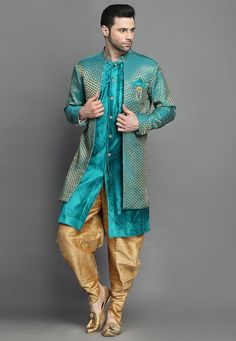 Art Brocade Silk and Art Silk Layered Sherwani in Teal BlueThis Readymade attire is Enhanced with Buttons. Crafted in Chinese Collar Neck and Full SleeveAvailable with an Art Silk Dhoti Pant in BeigeDo note: Brooch and Footwear shown in the image is for presentation purposes only. Half to one inch may vary in measurement. (Slight variation in actual color vs. image is possible) We sell all kinds of menswear. Mens Kurta | Mens Kurta Pajama | Mens Sherwani | Mens Sherwani Sets | Traditional Menswe Blue Traditional Drape Kurta With Dupatta, Blue Kurta With Dupatta In Traditional Drape, Blue Bandhgala For Navratri Designer Wear, Blue Straight Kurta Bandhgala For Navratri, Blue Long Sleeve Choli With Dupatta, Blue Traditional Wear With Dabka In Art Silk, Blue Art Silk Traditional Wear With Dabka, Blue Art Silk Traditional Wear With Dabka Embroidery, Traditional Blue Bandhgala With Resham Embroidery