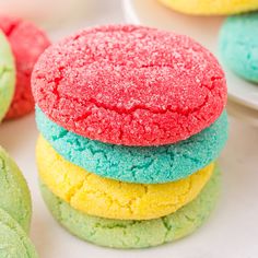 colorful cookies are stacked on top of each other