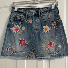 Women’s American Eagle Floral Patch Jean Skirt. Size 4. Never Worn- Excellent Condition! Tags Removed (Size Tag Removed As Well). Spring Skirt With Floral Embroidery, Casual Summer Mini Skirt With Floral Embroidery, Casual Floral Embroidery Skirt, Spring Mini Skirt With Floral Embroidery, High Rise Lined Skirt For Spring, Floral Embroidered Mini Skirt, Casual Embroidered Mini Skirt For Spring, Casual Blue Skirt With Floral Embroidery, Spring Embroidered Bottoms For Day Out