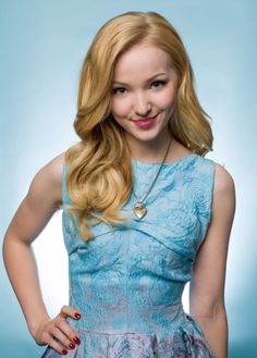 a young woman with long blonde hair wearing a blue dress and smiling at the camera