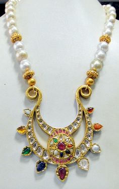 Vintage antique 23 K solid gold and natural Navratna gemstones set large pendant strung together with pearls and gold beads. Great one of type collection piece in very good condition. Length-Free size, Size of pendant-10/9 cm, gross weight-137 grams, pendant weight only-76 grams, Material-23 K gold, Natural uncut Diamonds, and Natural Navratna gemstones. Traditional 22k Gold Multi-stone Necklaces, Traditional Multi-stone 22k Gold Necklace, Temple Jewelry Multi-stone Necklace For Festivals, Festive Multi-stone Temple Necklace, Festival Multi-stone Temple Necklace, Round Pearl Pendant Necklace For Festivals, Diwali Pearl Pendant Necklace, Gold Multi-stone Kundan Temple Necklace, Gold Kundan Multi-stone Temple Necklace