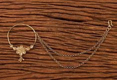 three different types of jewelry sitting on top of a wooden table