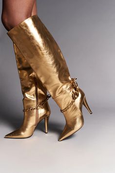 Crown – Twelve AM Co. Luxury Gold Boots With Pointed Toe, Luxury Gold Heeled Boots, Luxury Gold Glamorous Boots, Luxury Glamorous Metallic Boots, Luxury Gold Leather Boots, Luxury Gold Calf Leather Heels, Luxury Gold Boots With Almond Toe, Luxury Metallic Boots With Round Toe, Luxury Women's Boots With Metal Feet