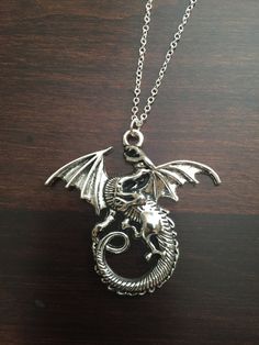 dragon, dragon necklace, dragon jewelry, silver dragon, silver dragon necklace, dragon pendant, silver necklace, necklace ★ Total Chain Length: 18 inches ★ Pendant Size: 43 mm x 46 mm This necklace is also available in gold: https://www.etsy.com/listing/251459116/dragon-dragon-necklace-dragon-jewelry?ref=shop_home_active_1 ★ Want to see more? Please click on: kmsupplies.etsy.com 26 Whale Jewelry, Whale Tail Necklace, Football Jewelry, Football Necklace, Necklace Dragon, Africa Earrings, Whale Necklace, Fox Jewelry, Foxes Necklace