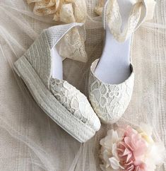 *Handcrafted Caroline luxe espadrilles in pretty lace for a sweet & romantic statement. *Made of delicate chantilly lace in pale ivory color *Unique Wedge heel made of natural jute traditionally handwoven in white color. *Rubber sole. .Lace Ribbon in ivory color matching the upper. *Heel measures : 4 inches ( 10 cm ) *Traditionally handmade in Spain. -SIZE: Contact us if you have any questions about sizes. Spring Wedding Shoes In Cream Lace, Beige Summer Wedding Shoes With Round Toe, Cream Lace Wedding Shoes For Spring, Spring Cream Lace Wedding Shoes, Spring Beach Wedding Closed Toe Shoes, Elegant White Wedge Heel Espadrilles, Beige Closed Toe Wedding Shoes For Spring, Spring Wedding Shoes With Round Toe, Elegant Cream Espadrilles For Beach