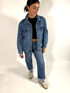 Cozy up for fall in this vintage-inspired oversize jacket. Featuring a slightly worn feel, this jacket is a medium wash to fit all of your aesthetics. 99% Cotton, 1% Spandex Model is wearing size Small Cute Oversized Jean Jacket Outfits, Fall Oversized Jean Jacket Outfits, Fall Outfits With Jean Jacket, Oversized Denim Jacket For Fall, Oversized 90s Denim Jacket For Fall, Oversized Jean Jacket Outfits, Oversized 90s Long Sleeve Denim Jacket, Jean Jacket Outfits Fall, Cute College Outfits