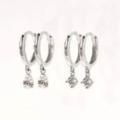 These 14K White Gold Small Hoop earrings will be your favorite earrings for the wedding day and everyday after. 14K White Gold Moissanite Crystals Hypoallergenic, lead and nickel free Thickness 1.8mm Diameter Sizes: Inside 8.2mm Stone Diameter: 3mm Click Snap closure #ES055-WG Silver Round Cut Tarnish-resistant Earrings, Silver Tarnish Resistant Earrings, Silver Tarnish-resistant Round Cut Earrings, Huggie Earrings With Lever Back For Wedding, Dainty Diamond Hoop Earrings Hypoallergenic, Hypoallergenic Small Hoop Diamond Earrings In White Gold, Dainty White Gold Hoop Earrings, Hypoallergenic White Gold Dangle Huggie Earrings, White Gold Dangle Huggie Earrings Fine Jewelry