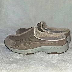 Easy Spirit Travel Fuzz Women Clog/Mule Taupe Color Size 6m For Comfort Travel Orthotics Friendly Sueded Leather Upper Faux Fur Trim Removable Footbed Features Shock Absorbing Arch Support For Non-Stop Comfort Textile Faux Fur Lined Textile Synthetic Lining Rubber Outsole Slip On Mule Eva Molded Midsole A Durable Rubber Outsole Is Excellent Traction, Helping To Secure Your Steps Manmade Balance Cozy, Soft, Comfy,Beautiful,Warm, Fuzzy, Walking, Outwear, Light Activities Casual Clogs, Slip On Mule Comfy Clogs With Rubber Sole And Round Toe, Comfortable Closed Toe Slip-ons For Walking, Casual Mules With Arch Support And Round Toe, Comfortable Synthetic Mules With Round Toe, Casual Slippers With Ortholite Insole And Round Toe, Casual Synthetic Mules For Winter, Synthetic Round Toe Clogs For Walking, Comfortable Beige Synthetic Clogs, Synthetic Clogs With Round Toe For Walking