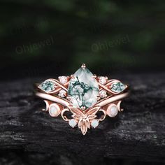 "This is a natural green moss agate  engagement ring in solid gold,about 6x8mm 1.3ct pear cut.  The accent stones are round 1.5mm moissanites and marquise cut 2x4mm moss agate. The matching band stones are round lab opals. The band width about 1.3-1.4mm. It can be made in any ring size. However please contact me to custom make it to a special big or small size. It can be made in white gold,rose gold or yellow gold with 14k or 18k. However for some people who are nickel allergic,I can also make it to 925 sterling silver to make you can wear it. The ring is handmade,very high quality! 30 days money back guarantee. Returns & Warranty 30-Day money back guarantee (starting from the day of delivery). \"Made to Order\" purchases qualify for our 30-day money back guarantee. The 30-day money back g Dainty Emerald Open Ring Jewelry, Exquisite Opal Ring For Gift, Exquisite Opal Ring Gift, 14k Gold Jewelry With Stone Setting For Anniversary, Heirloom Rose Gold Jewelry With Prong Setting, Dainty Rose Gold Opal Jewelry, White Gold Opal Jewelry Gift, White Gold Opal Jewelry As Gift, White Gold Opal Jewelry For Gift