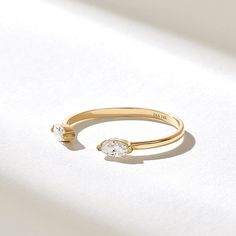 Elegant& Minimalist Real Solid Gold Open Stackable Ring with half bezel settled natural marquise diamonds Features * Made to Order. * Gold KT: 10K, 14K, 18K * Custom Gold Color: Rose Gold, Yellow Gold, White Gold * Diamond Color-Clarity: D-E-F color VVS clarity * Total CTW: 0.18 ctw * Width of Band: 1.43MM * Thickness of Band: 0.67MM * Ready to Ship in 5-7 Business Days ✓ We care about the environment,the jewelry we cast is made with recycled gold. We source exclusively post-consumer material th Luxury Open Band Solitaire Jewelry, Luxury Open Ring Stackable Rings With Bezel Setting, Luxury Classic Engraved Open Band Ring, Luxury Wide Band Open Ring For Promise, Open Wedding Ring, Promise Jewelry With Tension Setting And Open Band, Promise Jewelry With Tension Setting In Open Band, Cubic Zirconia Stackable Open Rings For Wedding, Fine Jewelry Anniversary Bypass Ring With Open Band