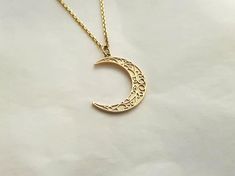 mens womens crescent moon necklace pendant made in 14k or 18k solid goldthe delicate patterns that make it more attractive are on the crescent moon pendant.model wears a 14k 1.7mm 50cm chain.free shipping on all orders via fedex!14k gold mens womens crescent moon pendant necklace weightpendant only 2.46g (±7%)with 1.4mm 42cm chain 5.11g (±7%)with 1.7mm 42cm chain 6.26g (±7%)with 2.1mm 42cm chain 8.21g (±7%)18k gold mens womens crescent moon pendant necklace weightpendant only 2.93g (±7%)with 1.4 Elegant Crescent Engraved Necklace, Elegant Engraved Crescent Necklace, Elegant Engraved Moon-shaped Necklace, Elegant Moon-shaped Engraved Necklace, Celestial Crescent Engraved Jewelry, Elegant Engraved Moon Necklace, Elegant Engraved Moon Shaped Necklace, Crescent Moon Charm Necklace In 14k Gold, Delicate Crescent Moon Phase Jewelry