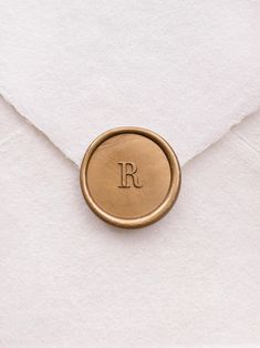 a close up of an envelope with a wax stamp on it