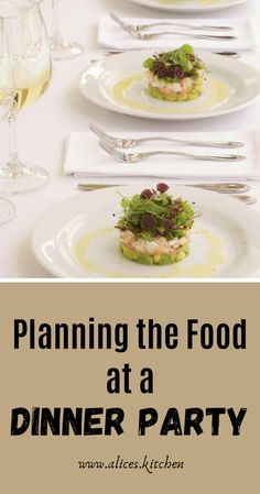 a white table topped with plates filled with food and wine glasses on top of it